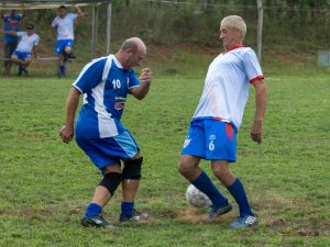 old men playing football