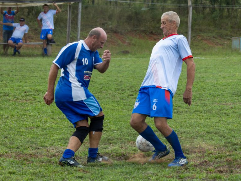 old men playing football