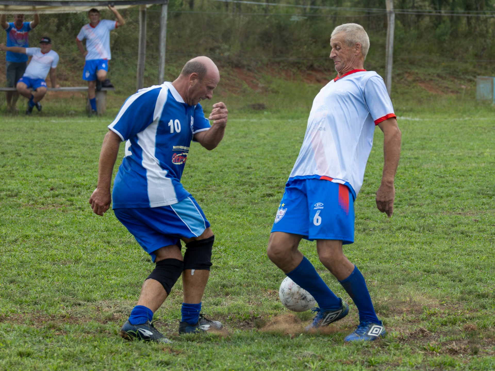 old men playing football